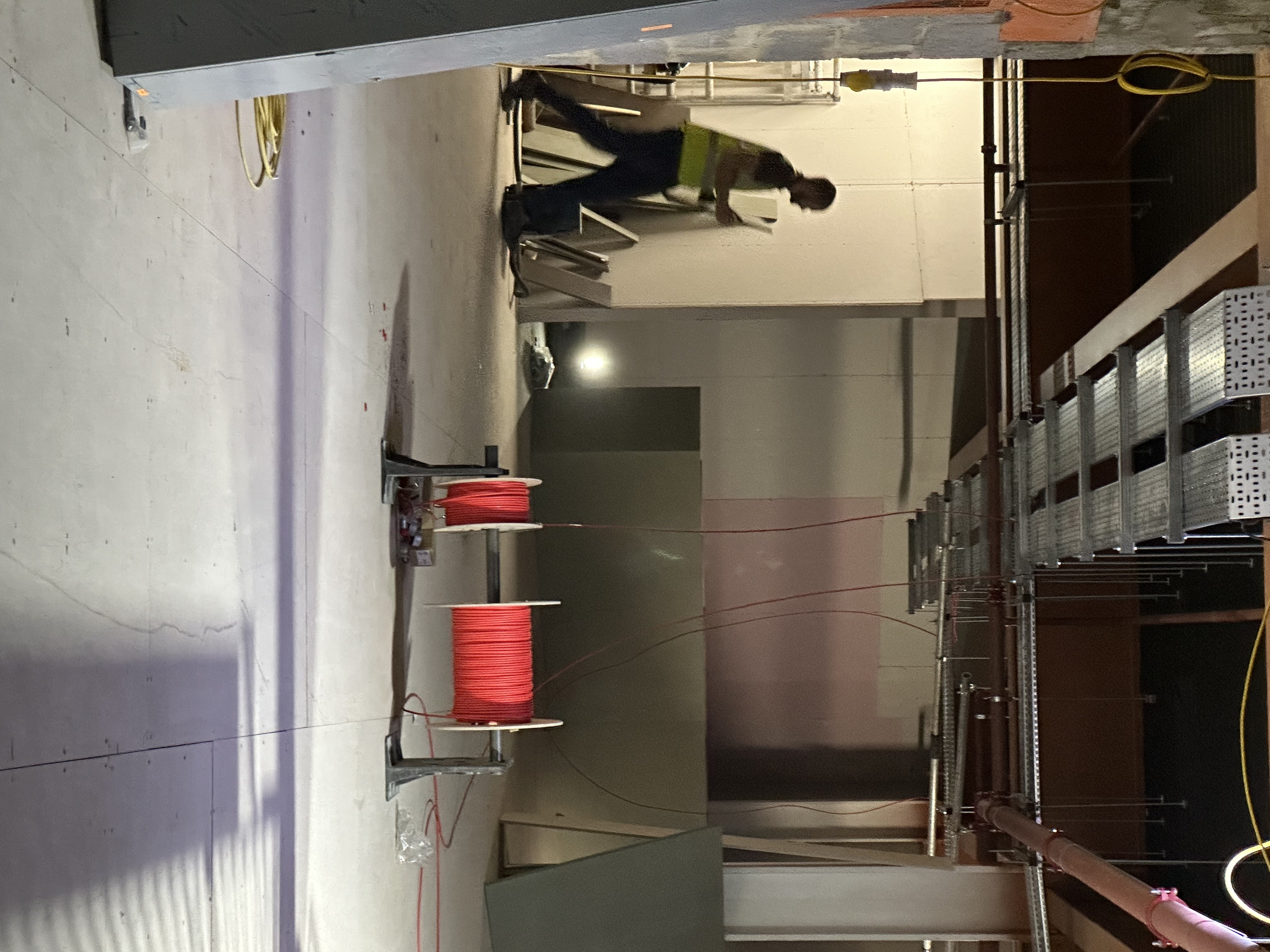 E-karting fit-out with overhead cable baskets and specialist red cable runs